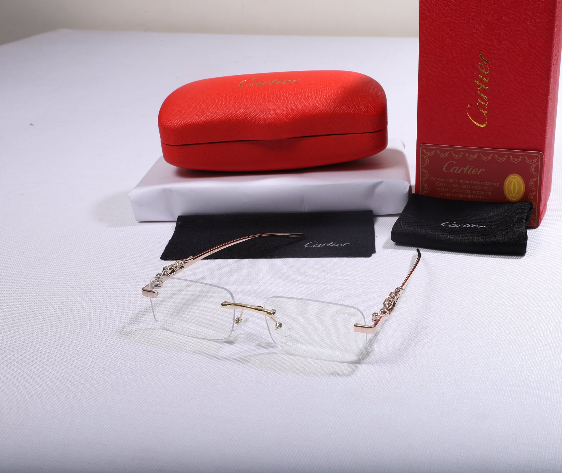 Cartier Elegant Clear Frame Eyewear with Decorative Accents