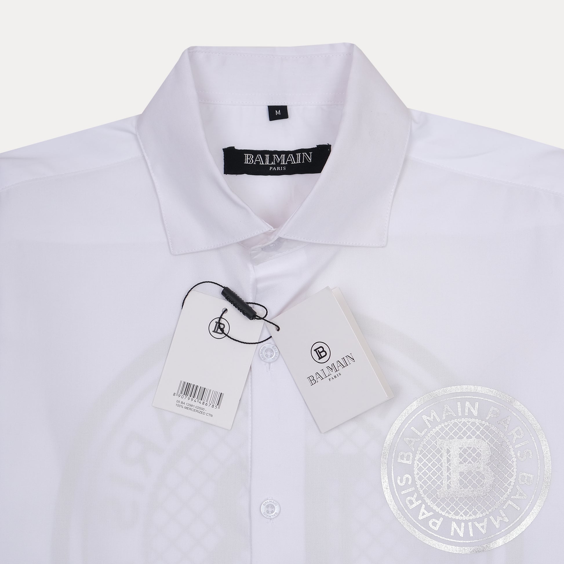 Balmain Elegant Silver Emblem Button-Up Shirt in Pristine White
