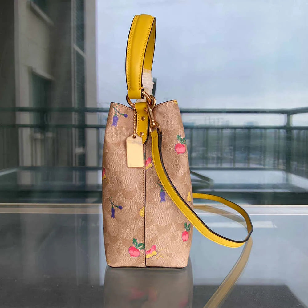 COACH Radiant Petal Floral Print Bucket Bag with Citrus Burst Accents