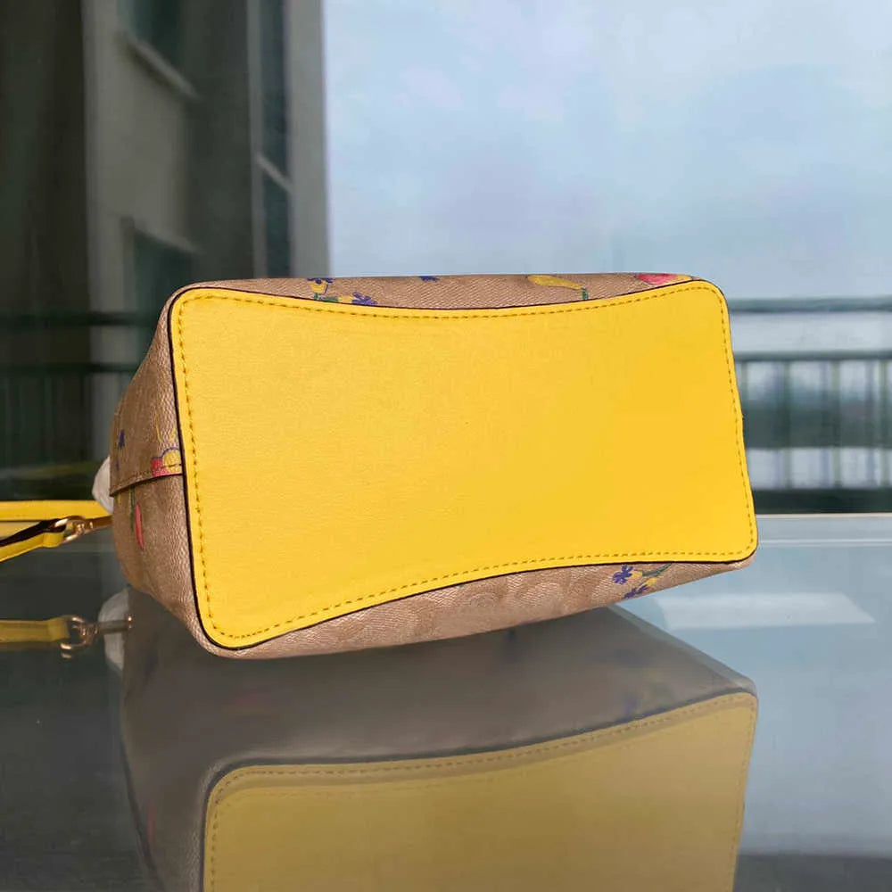 COACH Radiant Petal Floral Print Bucket Bag with Citrus Burst Accents