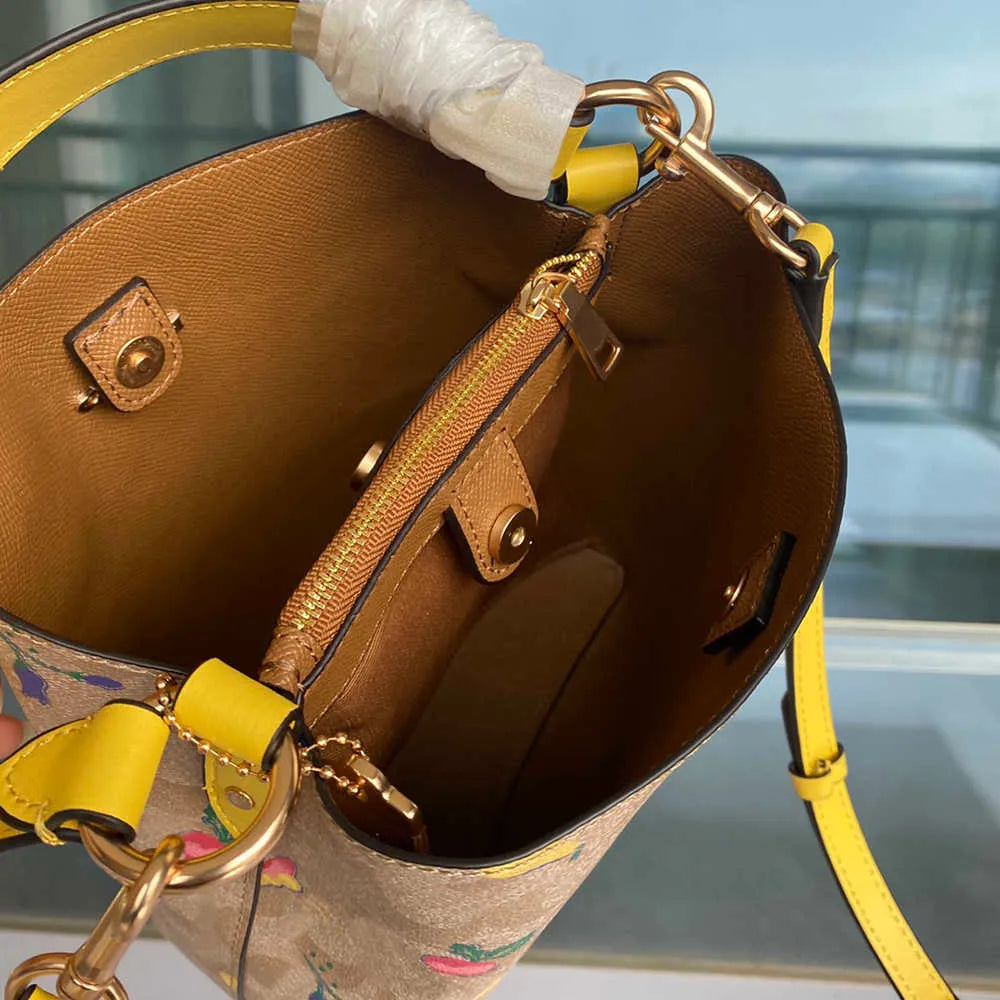 COACH Radiant Petal Floral Print Bucket Bag with Citrus Burst Accents