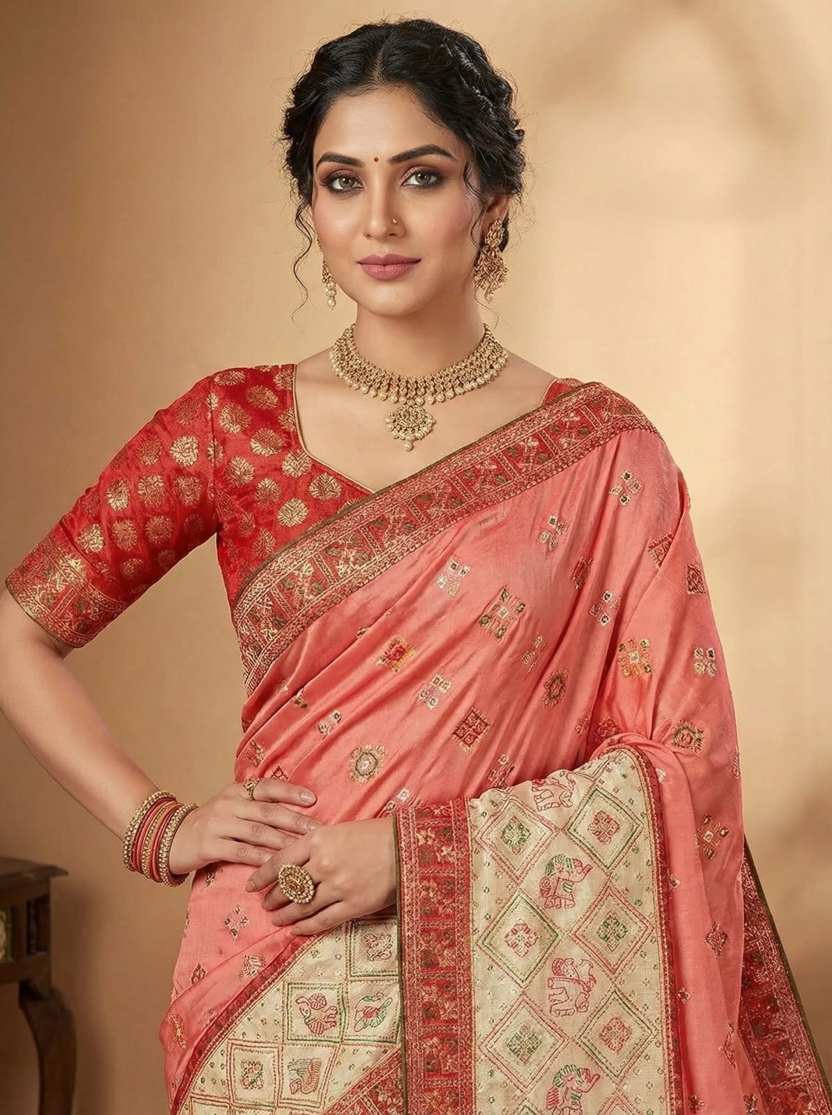 Elegant Weaves Coral Silk Saree with Intricate Gold Embroidery