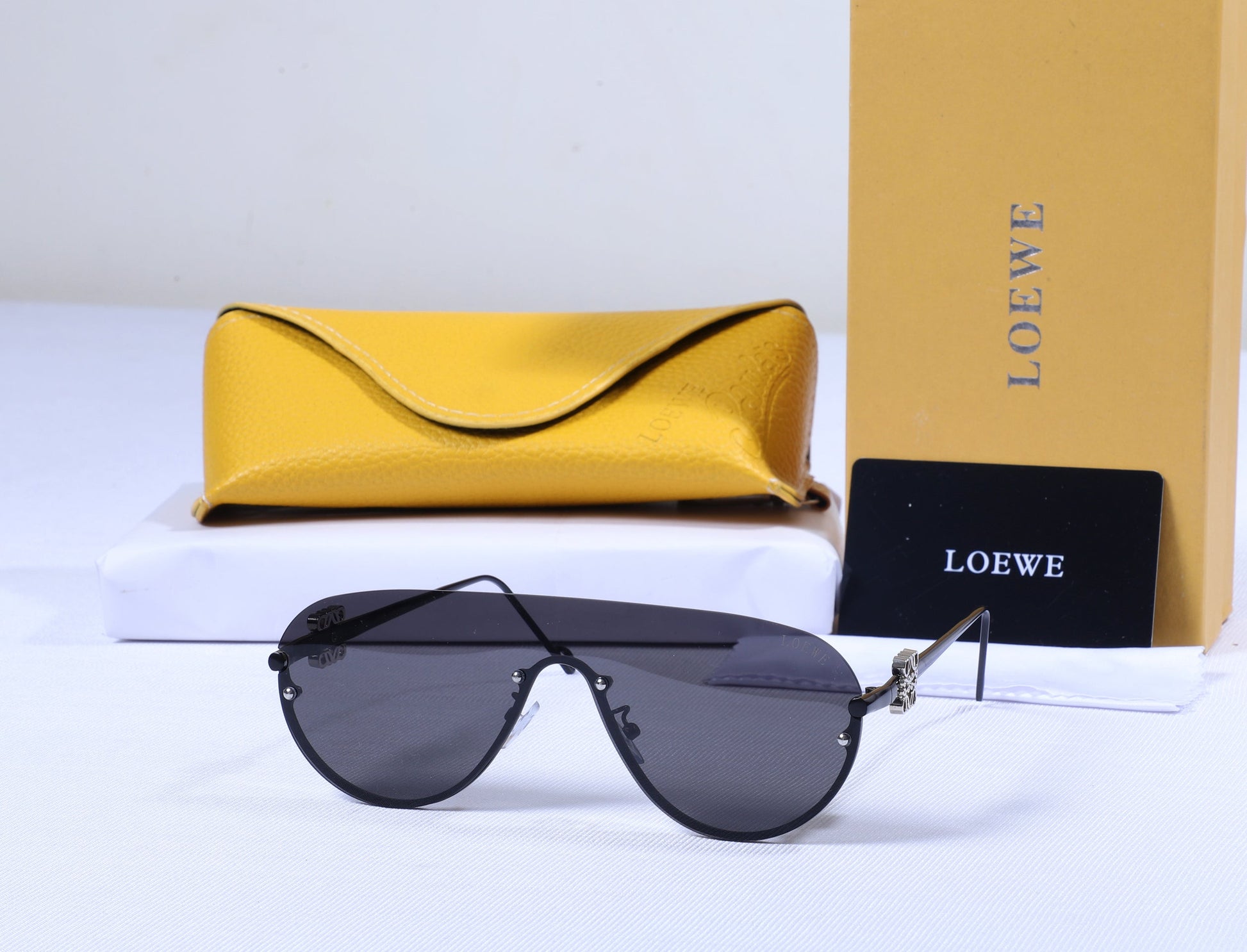 LOEWE Dusk Ember Aviator Sunglasses with Charcoal Lenses and Sunbeam Yellow Case