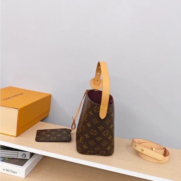 LOUIS VUITTON Ember Glow Apricot Monogram Bucket Bag with Pouch